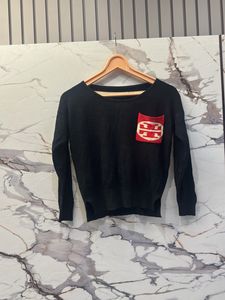 Black Sweater with Red Pocket Detail