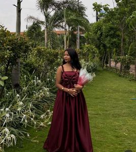 Elegant Maroon Gown with Bow Detail