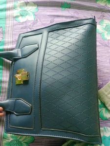 Stylish Teal Handbag with Gold Lock