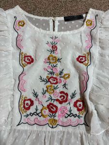 Embroidered White Peplum Top