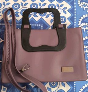 Chic Purple Handbag with Unique Handle