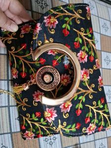 embroidered sling bag