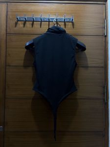 Sleek Black Turtleneck Sleeveless Bodysuit
