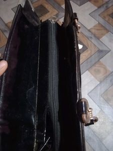 Chic Black Patent Handbag with Gold Chain