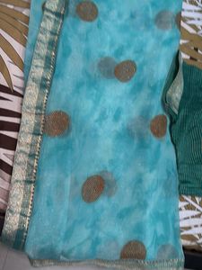Stunning Teal Blue Saree with Gold Accents