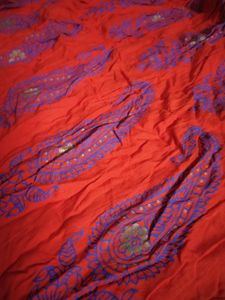 Ethnic skirt, deep Orange colour with blue print.