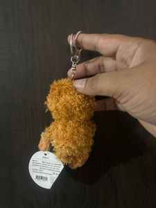 This is a fluffy orange-brown orangutan plush