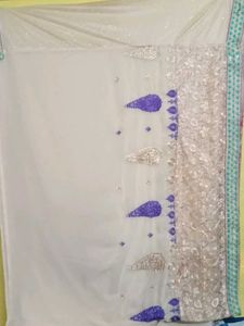 Elegant Beige Saree with Teal Border
