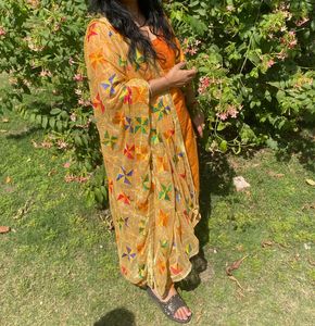 Musturd colour suit with fulkari dupatta