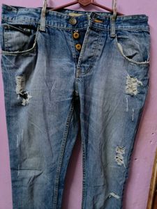 Distressed Blue Denim Jeans