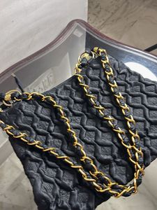 Stylish Black Textured Bag with Gold Emblem