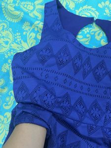 Blue Peplum Top with Cutout Detail