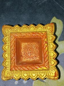 Pink Powder Puff For Babies And Decorated Diya