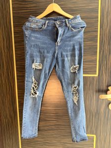 Distressed Blue Denim Jeans