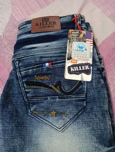 Distressed Blue Denim Jeans