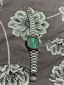 Green dial wrist watch