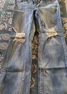 Distressed Blue Denim Jeans