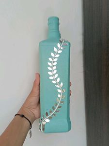 Decorative Teal Bottle with Vine Accent