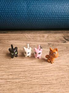 4 adorable cat figurines.