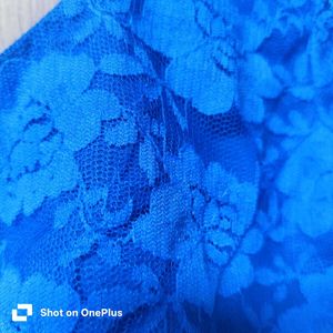 Elegant blue lace blouse with a back open
