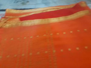 Vibrant Orange Saree with Golden