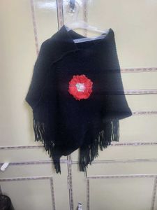 Chic Black Poncho with Red Flower Accent