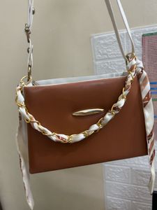 Stylish Brown Handbag with Scarf Detail