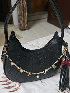Chic Black Embossed Hobo Bag with Charms