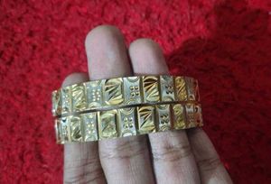 Gold Tone Ornate Bangles