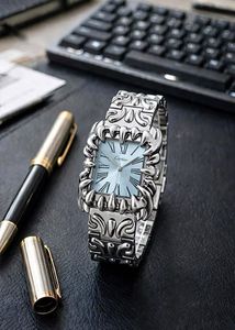 Silver Tone Watch with Intricate Design