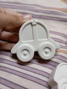 x3 pieces of concrete art cars