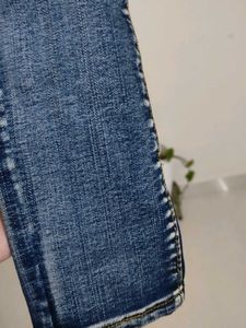 Distressed Blue Denim Jeans
