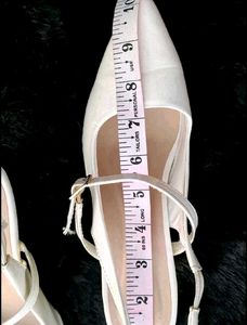 White Pointed Slingback Heels.