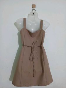 beige sleeveless A-line mini dress