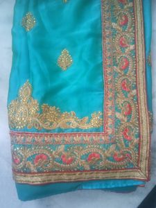 Elegant Teal Saree with Gold Embroidery