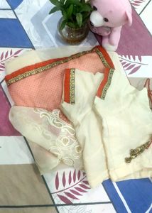 cream nd light orange saree with  Embroid