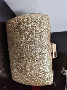styling and charming gold clutch
