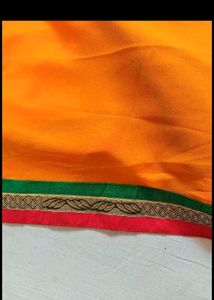 Vibrant Orange Saree with Golden Border
