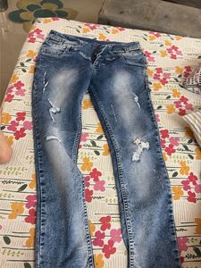 Distressed Blue Denim Jeans