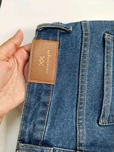 Flared Blue Jeans with Button Detail