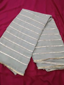 Elegant Grey Saree with Golden Stripes