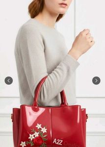 Vibrant Pink Patent Handbag with Floral Embroidery
