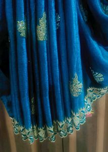 Elegant Teal Saree with Gold Embellishments