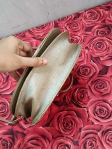 Gold sling bag