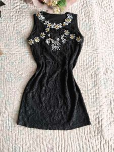 Small piece black mini dress