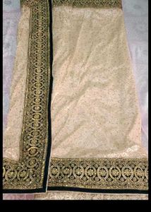 Elegant Cream Saree with Gold Embellishments