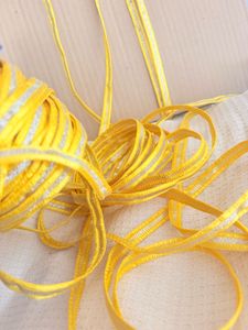 Yellow saree border with golden Silver Stripes