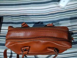 Stylish Brown Leather Handbag with Tassels