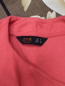 Coral Ribbed Asymmetrical Neck Top