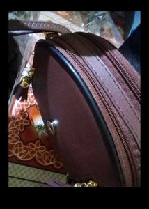 Stylish Round Maroon Handbag